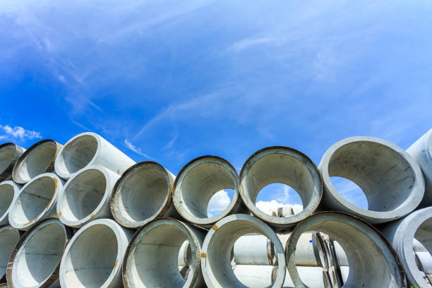 istock Stack of concrete drainage pipes for wells and water discharges 929735650