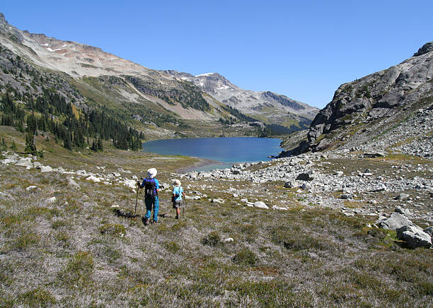 istock Couple Hiking Towards Alpine Lake 92973652