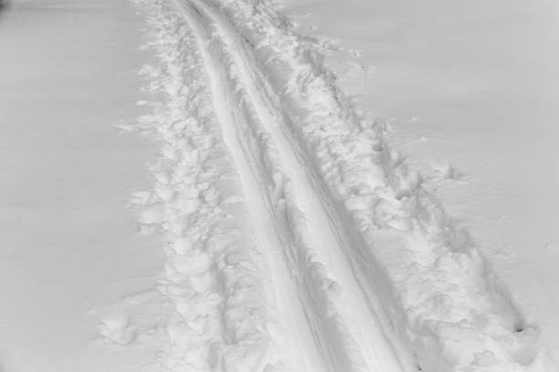 Trace of shoe in snow.
