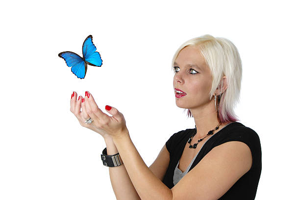istock Beautiful blond letting a butterfly go 92974113