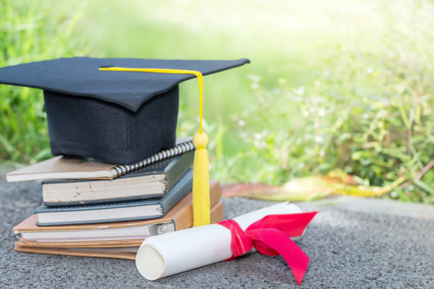 istock The cap and certificated in garden, Graduate education concept 929742152