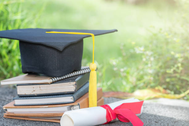 istock The cap and certificated in garden, Graduate education concept 929743064