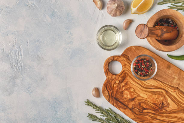 istock Cutting board and spice for cooking on a light background 929743074