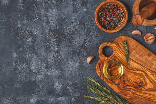 istock Cutting board and spice for cooking on a dark background. 929743082