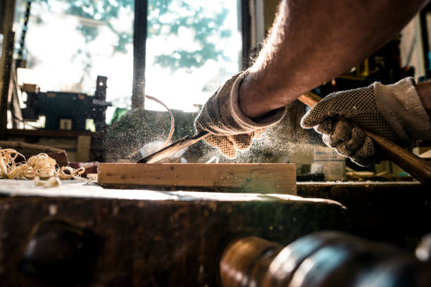 istock An experienced carpenter shapes wood with a chisel 929744518