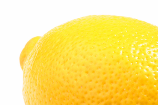 Macro still-life photography of partial yellow lemon for background image with copy space for texts