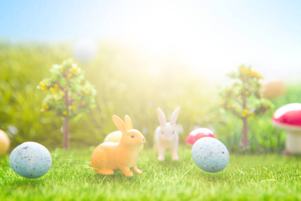 istock Easter rabbits toy on spring green grass. Fairy tale 929750692