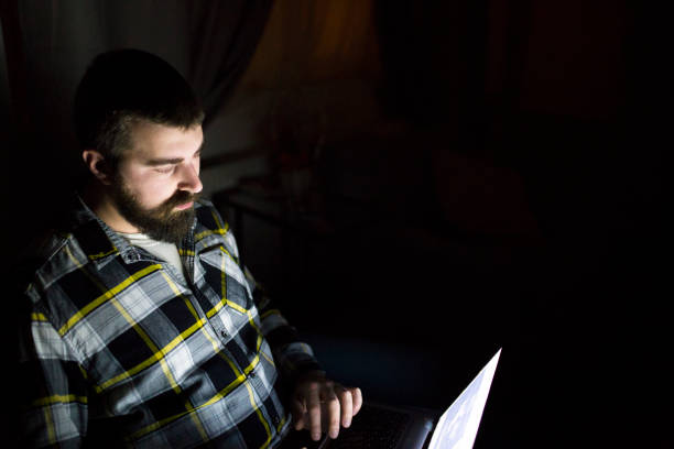 istock Bearded man at home working on laptop 929760344