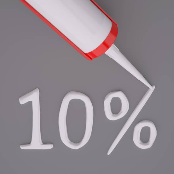 istock Silicone glue gun, writen 10% with glue isolated on gray background 929760784