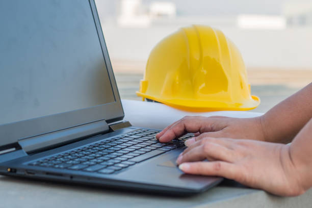 istock The human hands typing a keyboard on laptop at construction site 929761210