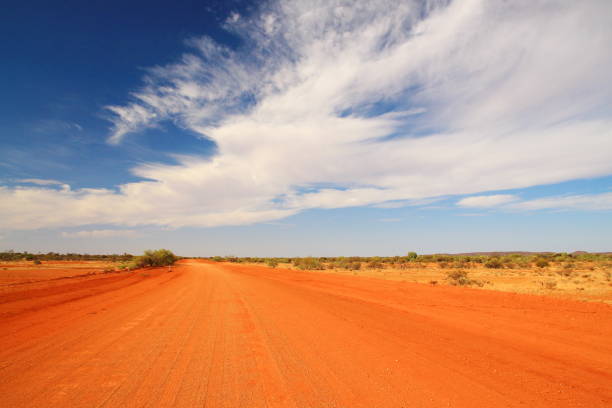 Red desert road across Australia stock photo