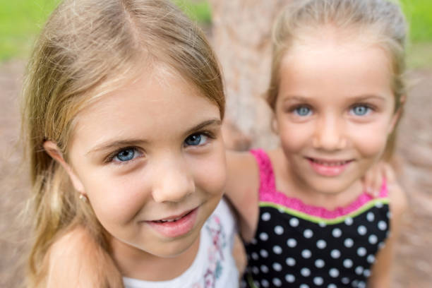 Sisters having fun and smiling at home