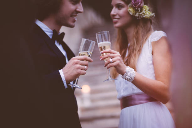 istock Happy bride and groom drinking champagne on wedding day 929780034
