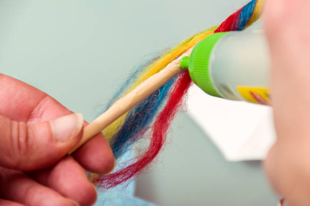 istock Close Up Woman Hands Decorating Wand Stick 929781338
