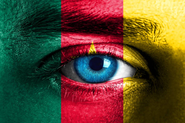 istock Human face painted with flag of Cameroon 929785684