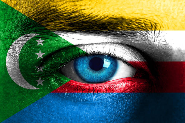 istock Human face painted with flag of Comorian 929786668