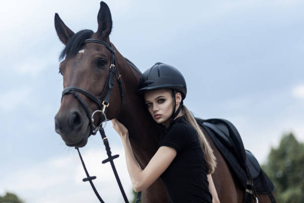 Buttom view of beautiful woman and expensive breed hourse