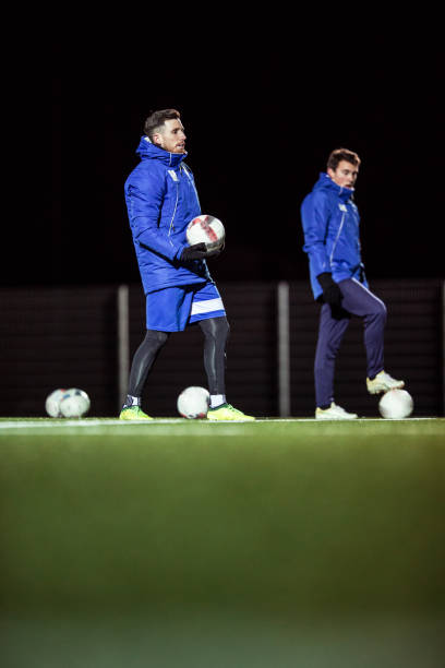 istock Goalkeepers Coach and his Assistant on Soccer Training 929790442
