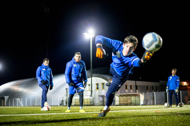 istock Goalkeeper Catching the Ball in Mid Air 929790476