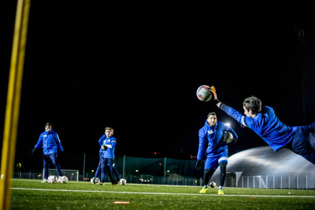istock Goalkeeper Catching the Ball in Mid Air 929790554