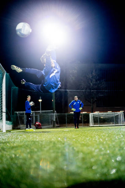 istock Goalkeeper Catching the Ball in Mid Air 929790570