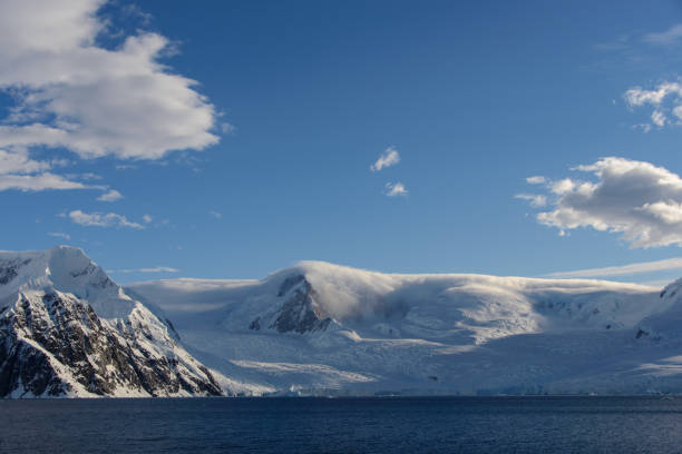 istock Antarctic landscape with glacier and mountains 929796912