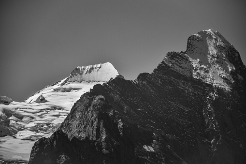 Black and white photo of Eiger in black and MÃ¶nch in white, contrasting against each other (Swiss Alps)