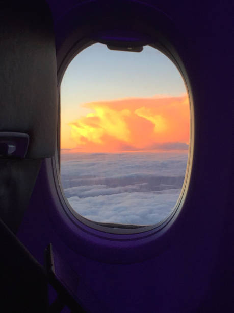 istock Sunset: towering fiery storm clouds from the air 929800208