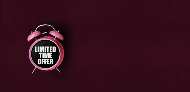 istock Limited time offer. Red alarm clock on Darck red background. Dark red web banner for black friday, sale, discount poster, store promotion. 929811944