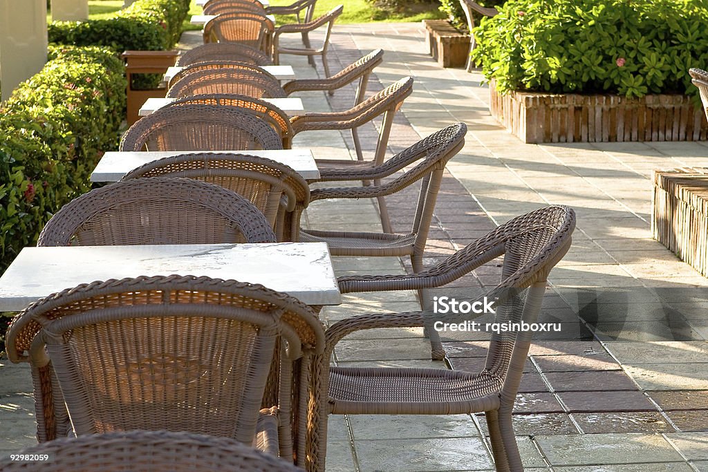 Table and four chairs on patio  Chair Stock Photo