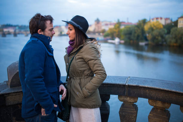 istock Couple talking on the bridge in Prague 929826542