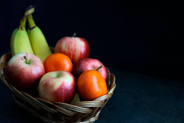 istock Dark Food - Chiaroscuro fruit with dark background 929827238
