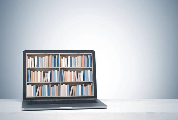 istock Laptop with bookshelves on screen, white desk side 929834036