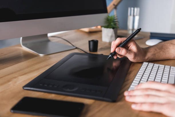 istock cropped shot of designer working with drawing tablet at workplace 929858566