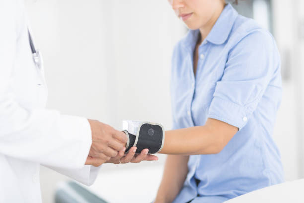 istock Doctor checking patient's blood pressure 929861938