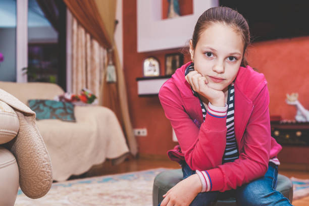 istock Young girl sitting in a cozy room 929864368
