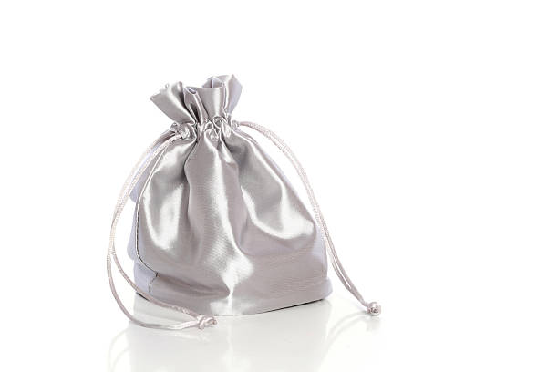 istock Small silk fashionable bag with cord on white background 92987124