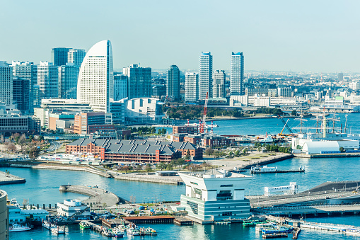 Tokyo, Japan - Dec. 7 2017 : panoramic modern city skyline aerial view of Yokohama and yokohama grand intercontinetal hotel under blue sky in Yokohama, Japan