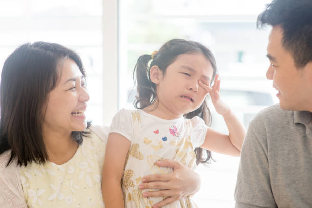 istock Parents comforting crying daughter 929876594