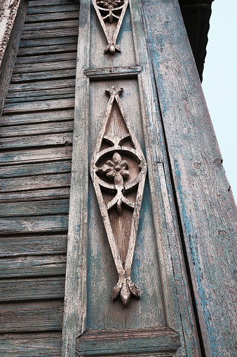 Element decoration of the facade of the old Russian wooden house of the period of the 19th century. Astrakhan city, Russia.