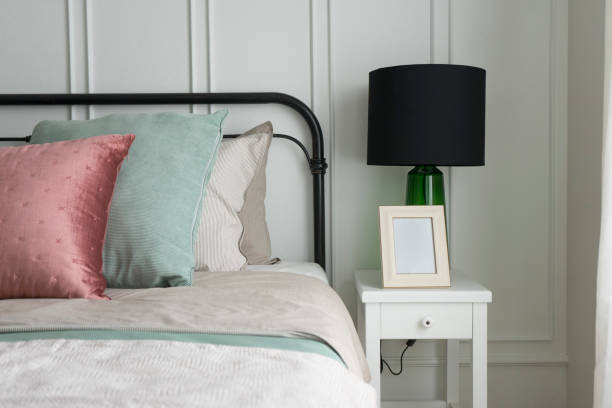 istock cozy bedroom with pastel pink and green pillows. 929878332