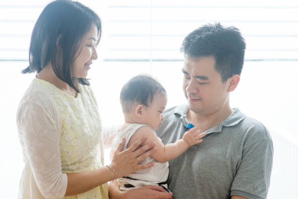 istock Asian parents and baby son 929878504