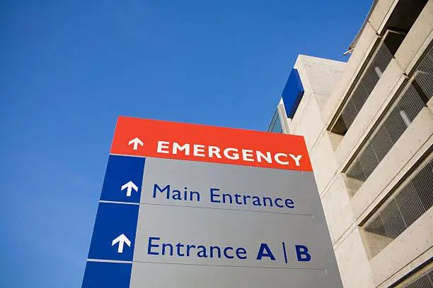 Photo of Emergency sign outside modern hospital