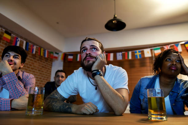 istock Friends cheering sport at bar together 929888308