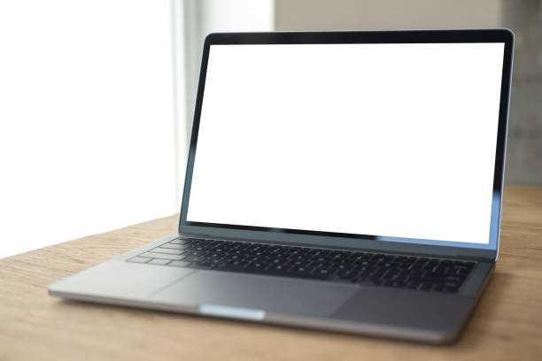 istock Mockup image of laptop with blank white desktop screen on wooden table in modern cafe 929888526