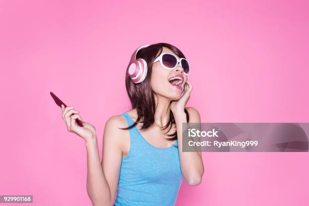 Woman Use Phone Listen Music Stock Photo - Download Image Now - Headphones, Women, One Woman Only