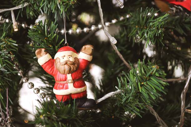 istock Santa Claus doll with Christmas tree. For background. 929905046