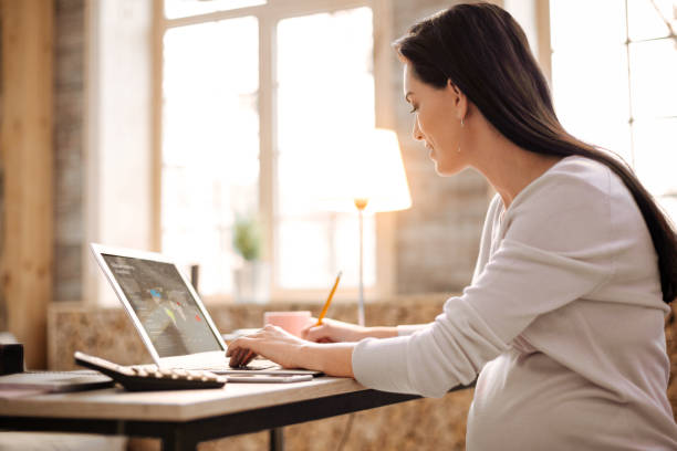 istock Ambitious pregnant woman writing down ideas 929908438