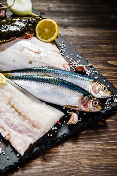 istock Fresh raw fish fillets on cutting board 929908580