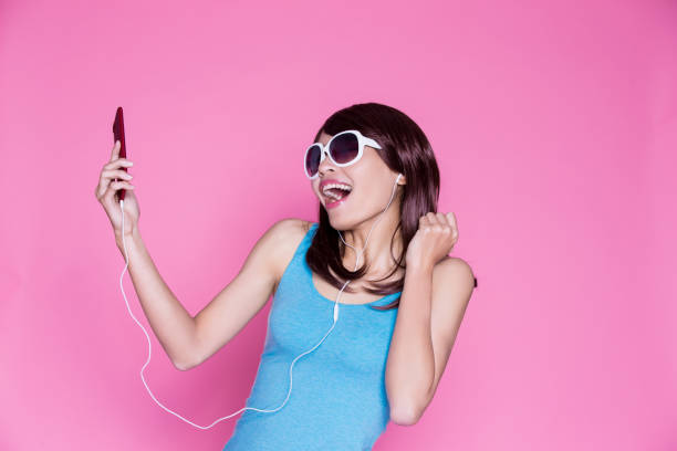istock woman use phone listen music 929912036